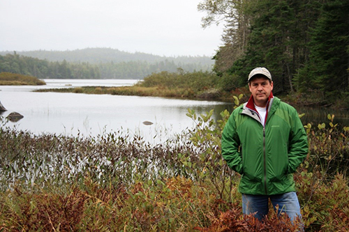 Ray Plourde standing next to Ship Harbou-Long Lake Wilderness Area