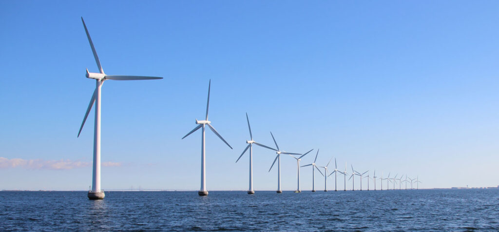 Row of wind turbines in the water
