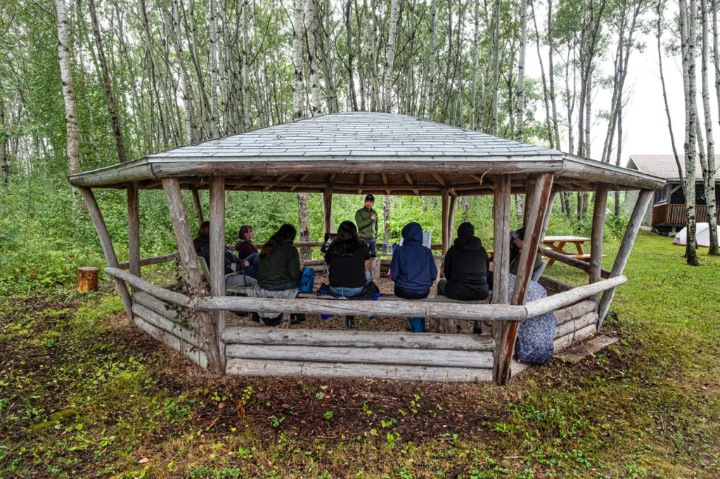 Group siting under small wood structure