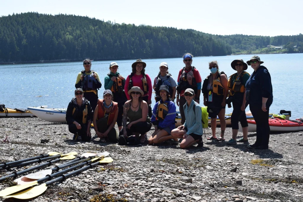 Group posing near lake