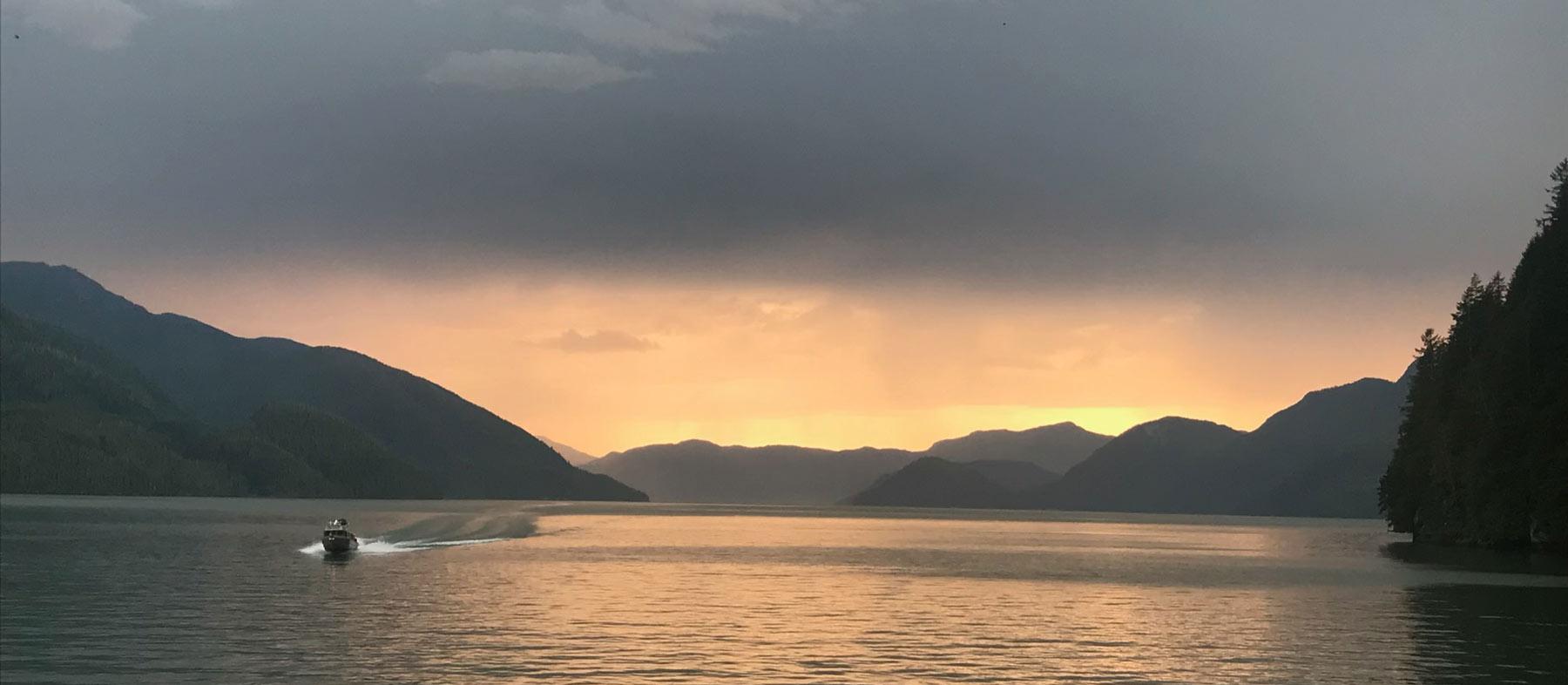Lac at sundown with mountains in the background