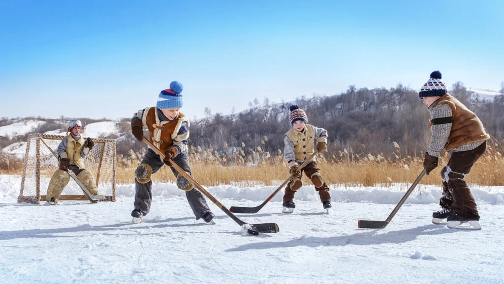 Child playing ice hockey.