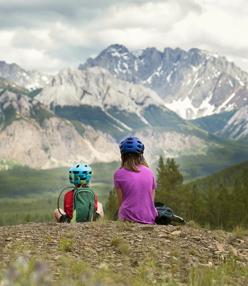A big sister and her little-brother on a family mountain bike ride in Kananaskisé, Albert