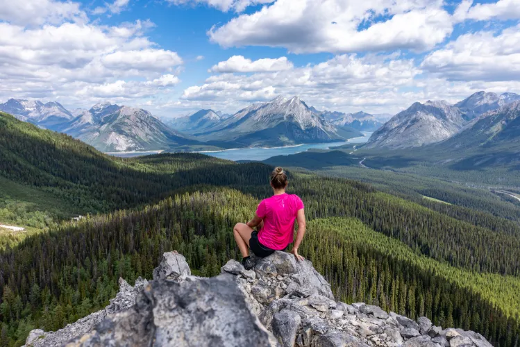 a person sitting atop a mountain